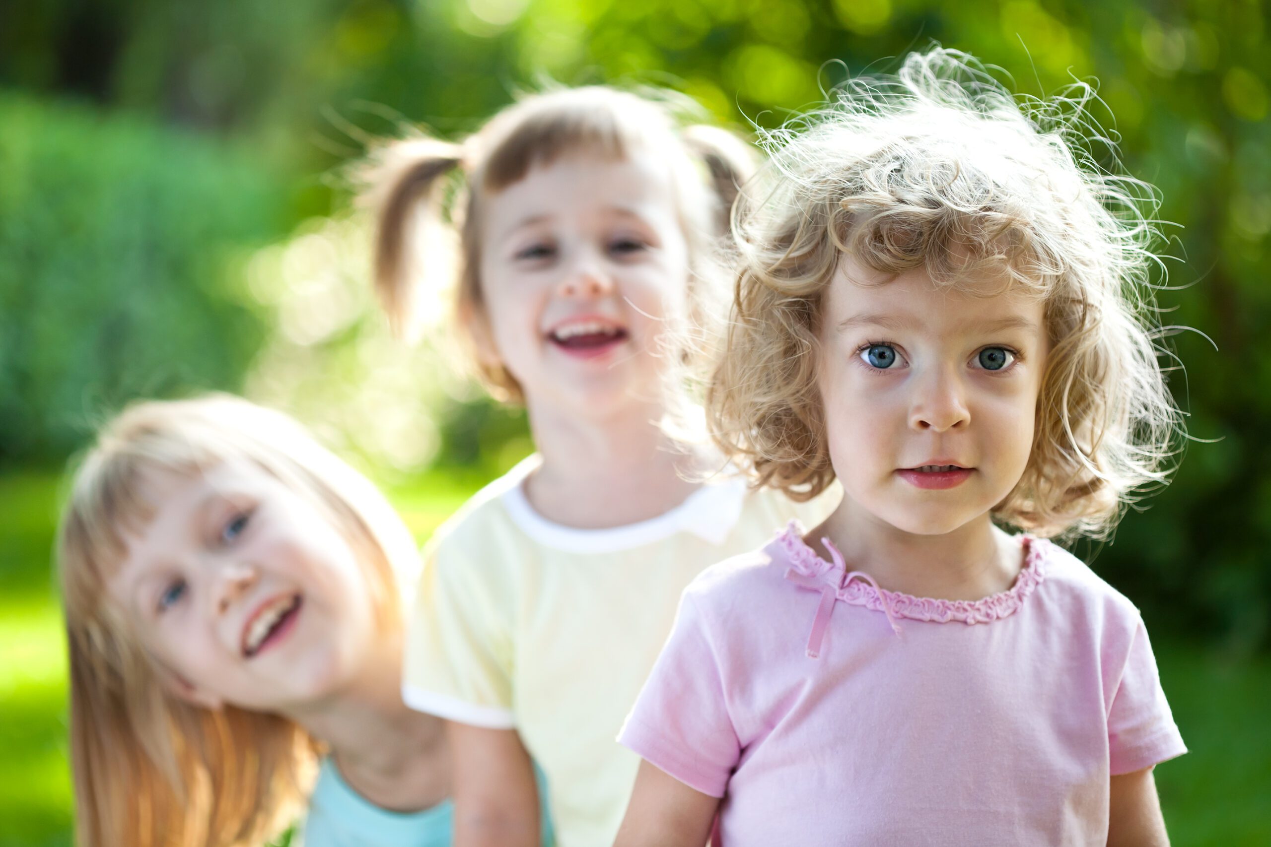"Group of happy smiling friends playing outdoors in spring park. Please, see more summer photos in my lightbox"